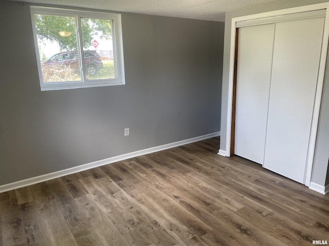 304 Lynda Dr Unit A/B, Carbondale, IL 62901 - unfurnished bedroom featuring a closet and wood finished floors