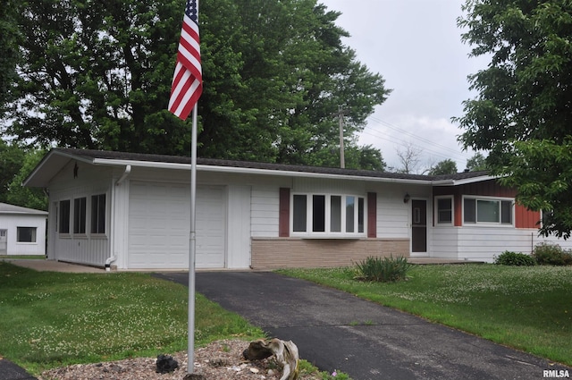30154 395th Ave, Bellevue, IA 52031 - ranch-style house with driveway, a front yard, and brick siding