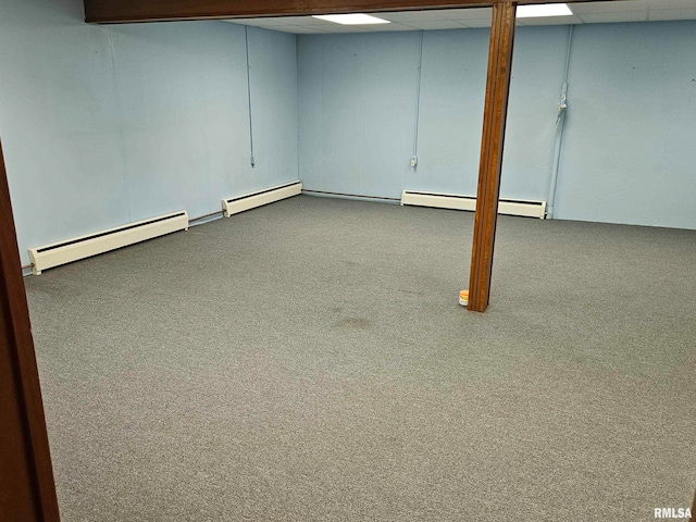 30154 395th Ave, Bellevue, IA 52031 - finished basement featuring carpet flooring, a baseboard radiator, and a drop ceiling