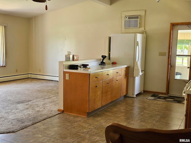 30154 395th Ave, Bellevue, IA 52031 - kitchen with freestanding refrigerator, carpet floors, an AC wall unit, light countertops, and a ceiling fan