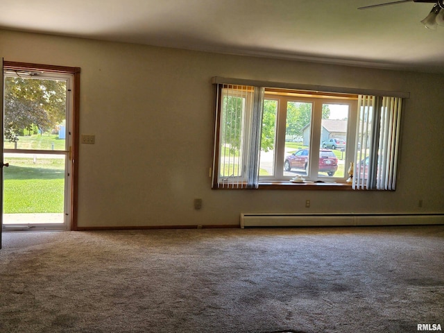 30154 395th Ave, Bellevue, IA 52031 - empty room featuring a baseboard heating unit, carpet floors, and a ceiling fan