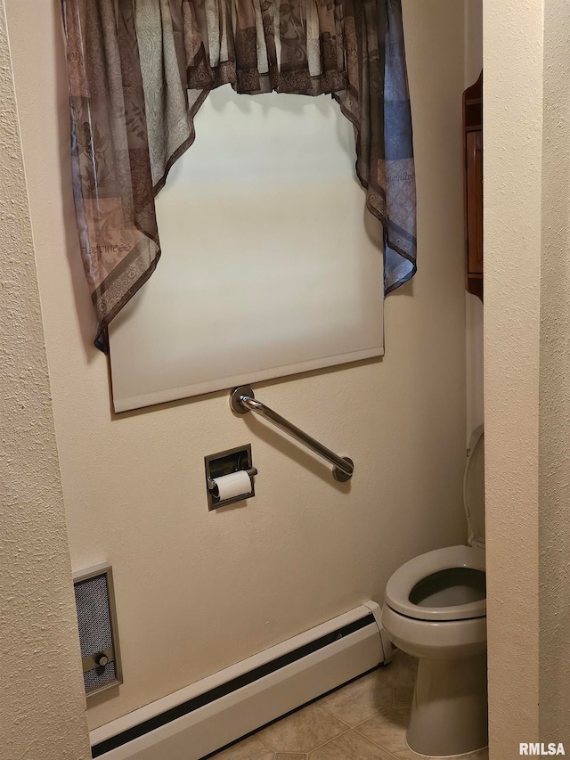 30154 395th Ave, Bellevue, IA 52031 - bathroom featuring baseboard heating and tile patterned floors