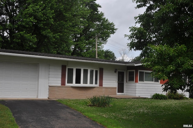 30154 395th Ave, Bellevue, IA 52031 - single story home with brick siding, asphalt driveway, a front yard, and an attached garage