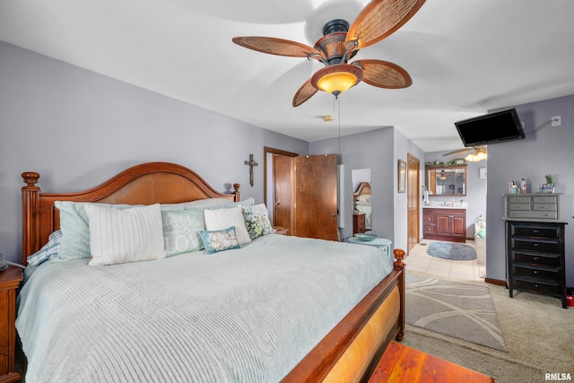 412 24th Ave, East Moline, IL 61244 - bedroom with connected bathroom, ceiling fan, and carpet
