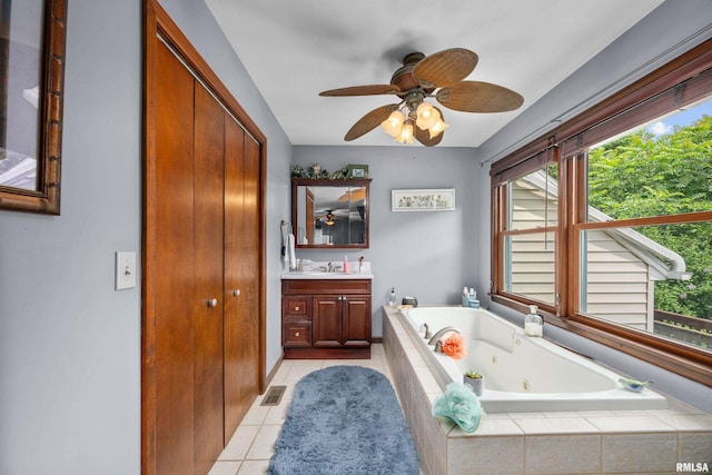 412 24th Ave, East Moline, IL 61244 - bathroom featuring vanity, a jetted tub, tile patterned flooring, and a ceiling fan