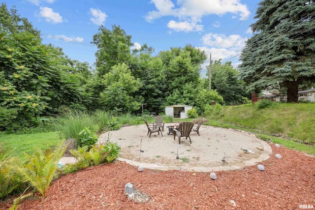 412 24th Ave, East Moline, IL 61244 - view of yard featuring a storage unit and a patio