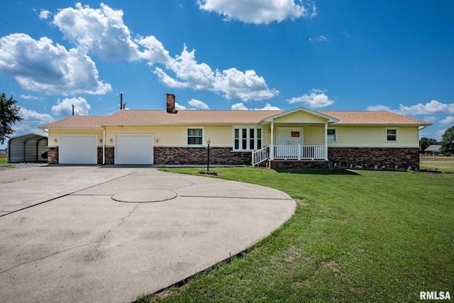 1903 Melvin Rd, West Frankfort, IL 62896 - ranch-style house with a front yard, concrete driveway, covered porch, a garage, and brick siding