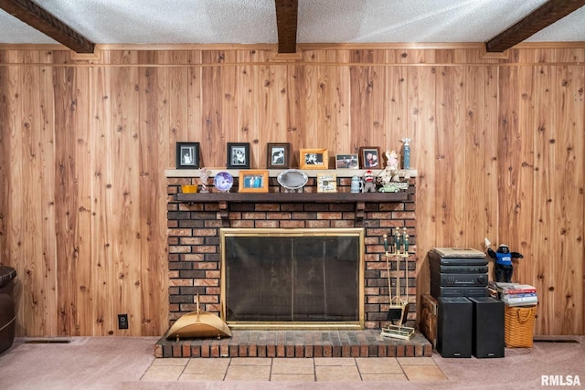 1903 Melvin Rd, West Frankfort, IL 62896 - detailed view of beam ceiling, a brick fireplace, a textured ceiling, wood walls, and carpet