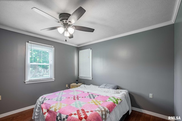 5680 State Route 146 E Highway, Vienna, IL 62995 - bedroom with dark wood-type flooring, a textured ceiling, crown molding, and ceiling fan
