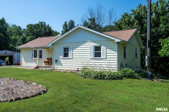 5680 State Route 146 E Highway, Vienna, IL 62995 - view of front of property with a front lawn and a shingled roof