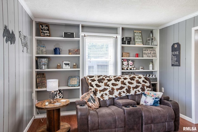 5680 State Route 146 E Highway, Vienna, IL 62995 - living area featuring a textured ceiling, wood finished floors, crown molding, and wooden walls