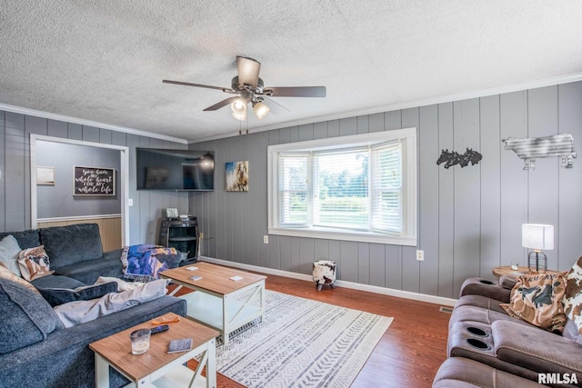 5680 State Route 146 E Highway, Vienna, IL 62995 - living area featuring ornamental molding, a ceiling fan, wood finished floors, and a textured ceiling