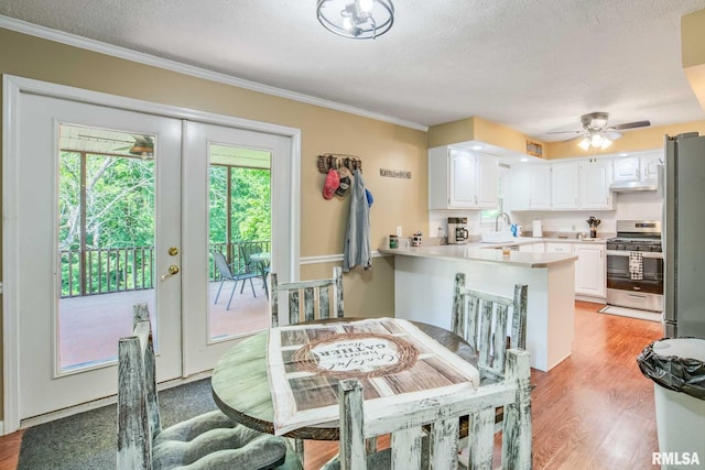 5680 State Route 146 E Highway, Vienna, IL 62995 - dining area with light wood-style floors, ornamental molding, ceiling fan, and a textured ceiling