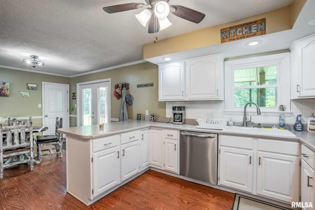 5680 State Route 146 E Highway, Vienna, IL 62995 - kitchen with dishwasher, a peninsula, wood finished floors, a ceiling fan, and light countertops