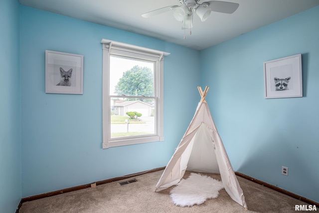1817 W 3rd St, Milan, IL 61264 - recreation room featuring carpet flooring and a ceiling fan