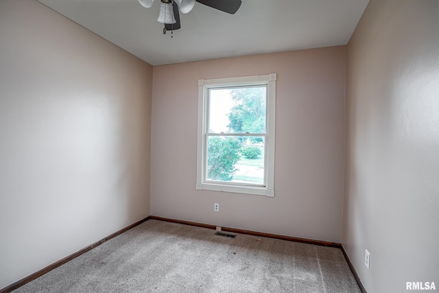 1817 W 3rd St, Milan, IL 61264 - empty room featuring carpet floors and a ceiling fan