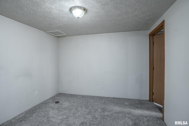 1817 W 3rd St, Milan, IL 61264 - unfurnished room featuring carpet, attic access, and a textured ceiling