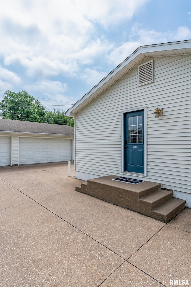 1817 W 3rd St, Milan, IL 61264 - doorway to property featuring a garage