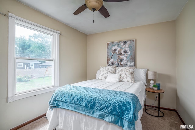 1817 W 3rd St, Milan, IL 61264 - bedroom with multiple windows, carpet flooring, and a ceiling fan