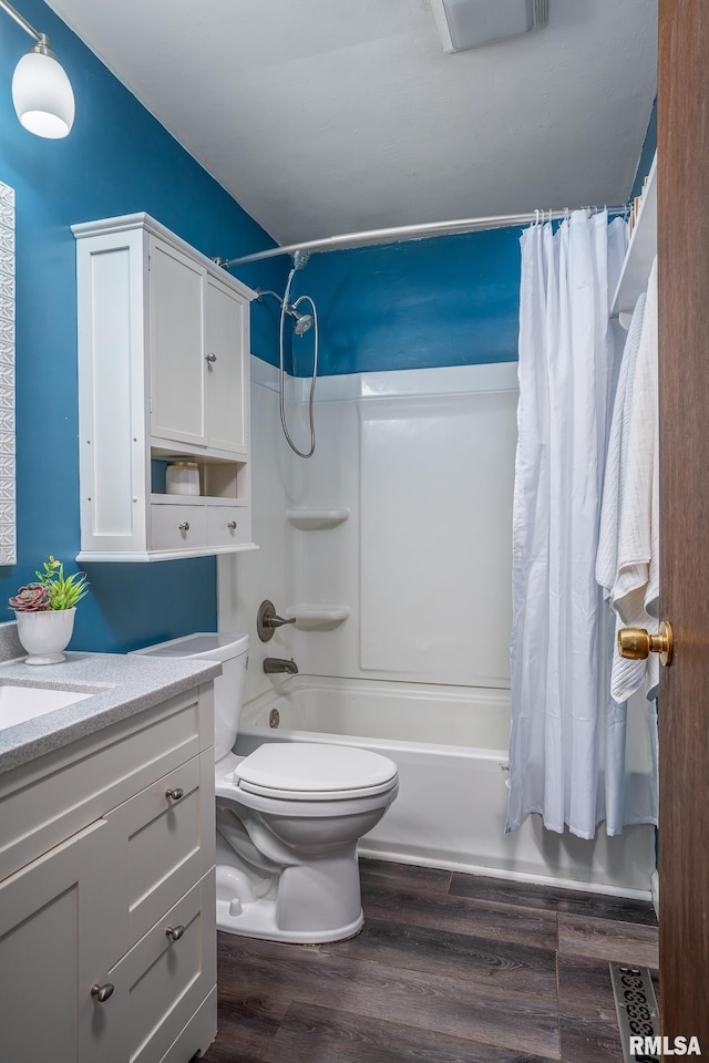 1817 W 3rd St, Milan, IL 61264 - full bath featuring shower / bath combo, vanity, and wood finished floors