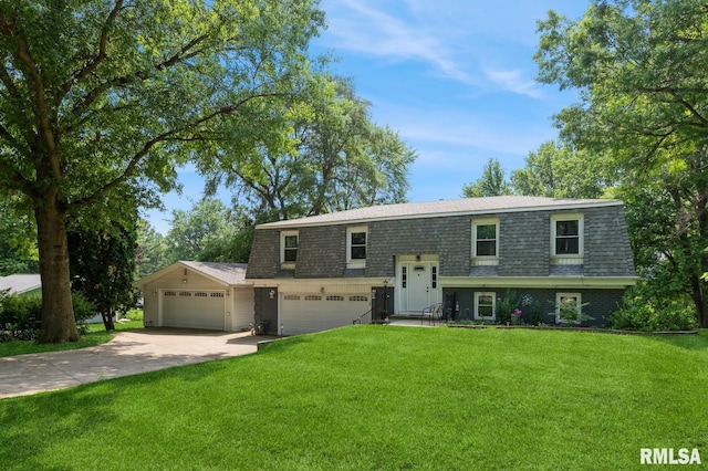 15611 Willow Ct, Sterling, IL 61081 - split foyer home with roof with shingles, concrete driveway, a front yard, mansard roof, and an attached garage