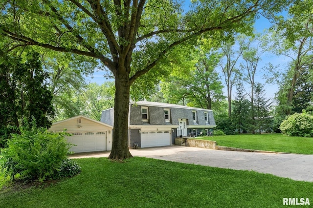 15611 Willow Ct, Sterling, IL 61081 - view of front of house with a shingled roof, a front lawn, concrete driveway, and view of wooded area