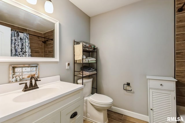 15611 Willow Ct, Sterling, IL 61081 - bathroom with vanity, curtained shower, and wood finished floors