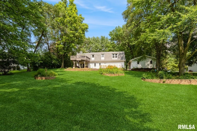 15611 Willow Ct, Sterling, IL 61081 - view of grassy yard featuring a wooden deck and a garage