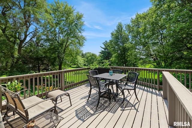 15611 Willow Ct, Sterling, IL 61081 - wooden terrace with outdoor dining space and view of wooded area