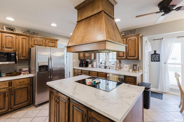 10224 Illinois Steel Rd, Johnston City, IL 62951 - kitchen with stainless steel appliances, premium range hood, light tile patterned flooring, ceiling fan, and recessed lighting