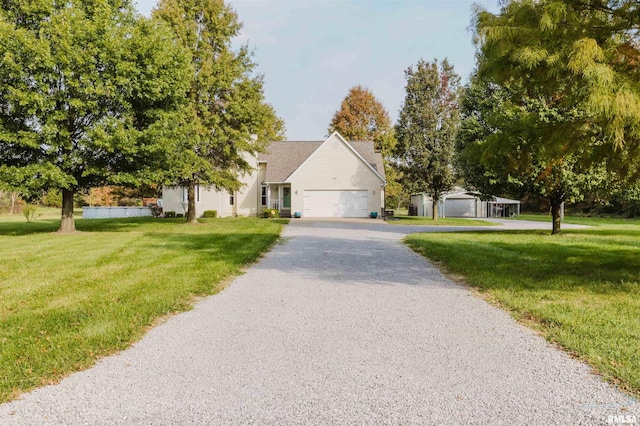 10224 Illinois Steel Rd, Johnston City, IL 62951 - view of property hidden behind natural elements with a front yard, asphalt driveway, and a garage