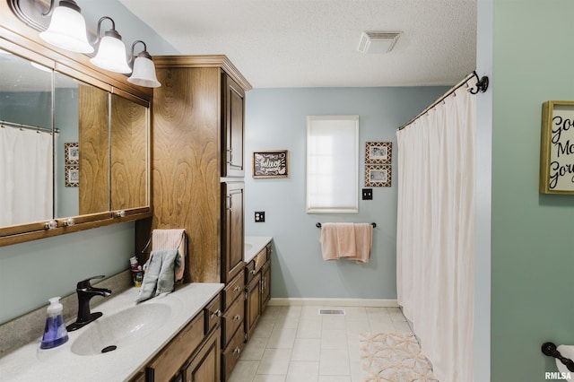 10224 Illinois Steel Rd, Johnston City, IL 62951 - bathroom with double vanity, a textured ceiling, tile patterned floors, and curtained shower