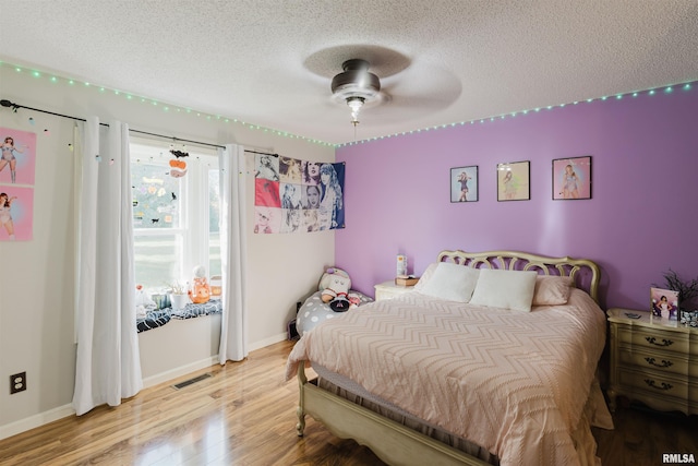 10224 Illinois Steel Rd, Johnston City, IL 62951 - bedroom featuring a textured ceiling and light wood-style flooring