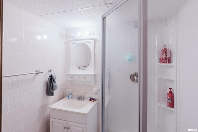 10224 Illinois Steel Rd, Johnston City, IL 62951 - full bath with vanity, a shower stall, tile walls, and a textured ceiling