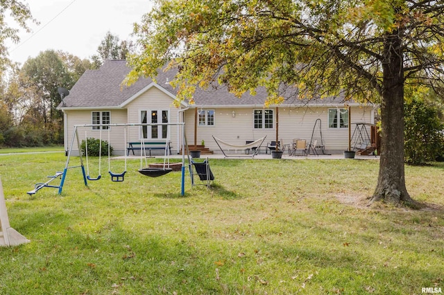 10224 Illinois Steel Rd, Johnston City, IL 62951 - rear view of house with a patio, a lawn, roof with shingles, and french doors