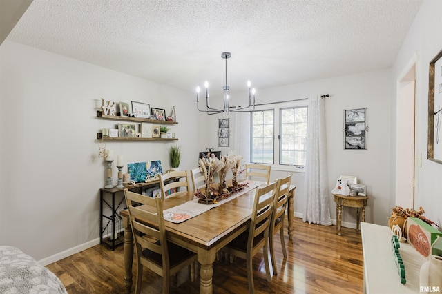 10224 Illinois Steel Rd, Johnston City, IL 62951 - dining space featuring a chandelier, wood finished floors, and a textured ceiling