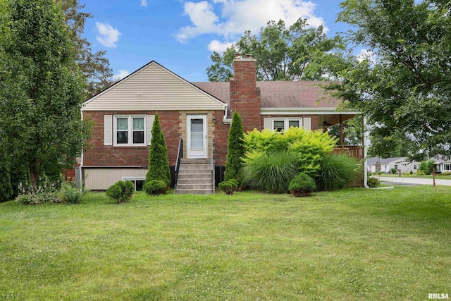 5003 48th St, Moline, IL 61265 - bungalow-style home with a chimney, brick siding, and a front lawn
