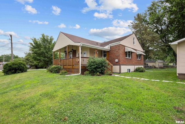 5003 48th St, Moline, IL 61265 - view of side of home featuring covered porch, a lawn, brick siding, and roof with shingles