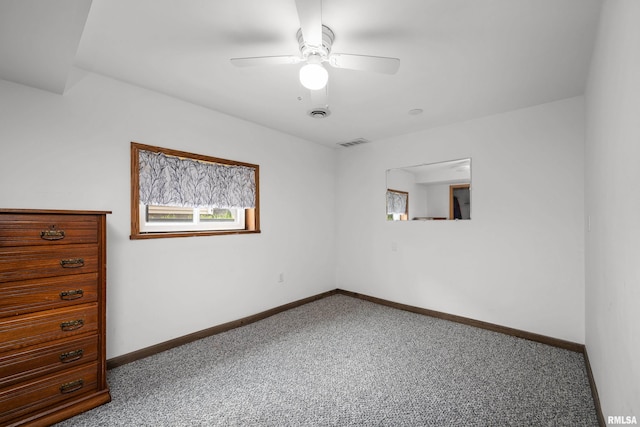 5003 48th St, Moline, IL 61265 - carpeted spare room featuring a ceiling fan and baseboards