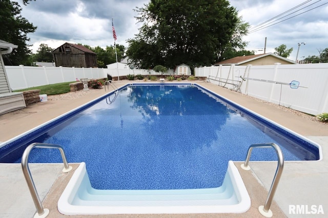 2024 Lind St, Quincy, IL 62301 - view of swimming pool with a fenced backyard and a storage shed