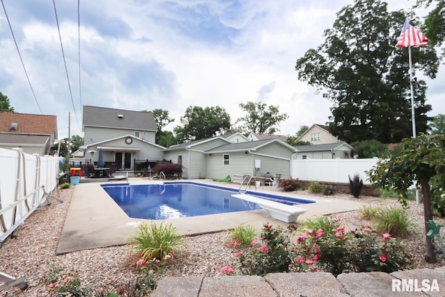 2024 Lind St, Quincy, IL 62301 - view of pool with a patio area, a diving board, and a fenced backyard