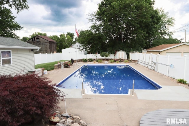 2024 Lind St, Quincy, IL 62301 - view of swimming pool featuring a shed, a fenced backyard, and a patio area