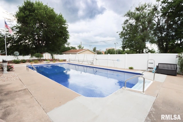 2024 Lind St, Quincy, IL 62301 - view of swimming pool with a fenced backyard, a patio area, and a storage unit