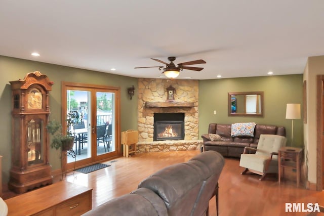 2024 Lind St, Quincy, IL 62301 - living room with wood finished floors, a ceiling fan, recessed lighting, and a stone fireplace