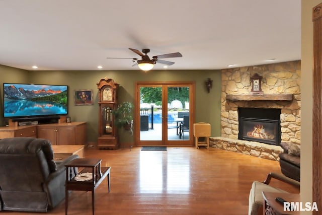 2024 Lind St, Quincy, IL 62301 - living room featuring wood finished floors, recessed lighting, a ceiling fan, and a fireplace