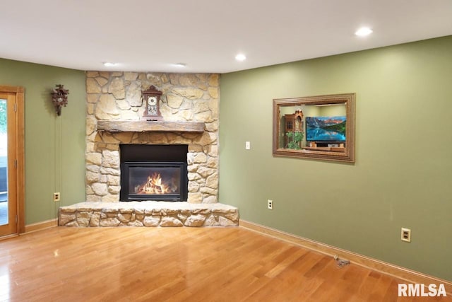 2024 Lind St, Quincy, IL 62301 - unfurnished living room featuring wood finished floors, a fireplace, and recessed lighting
