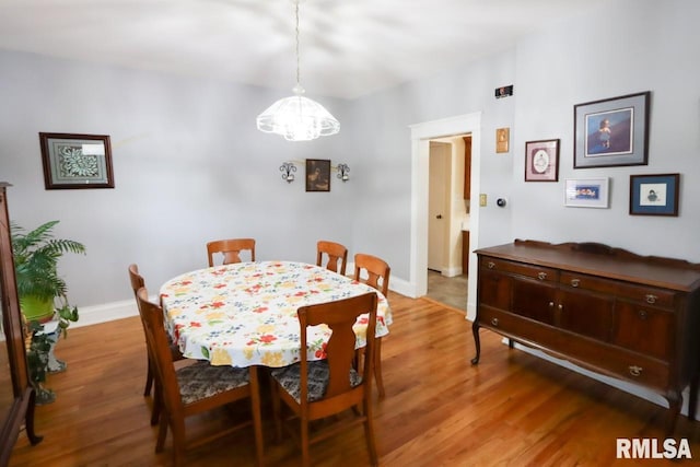 2024 Lind St, Quincy, IL 62301 - dining area featuring light wood-style flooring and a chandelier