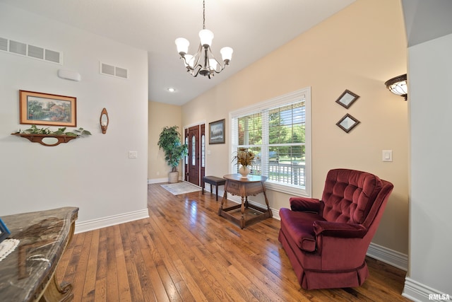 627 10th Ave, Silvis, IL 61282 - sitting room featuring a chandelier and wood-type flooring