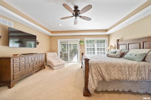627 10th Ave, Silvis, IL 61282 - bedroom featuring access to outside, light colored carpet, ceiling fan, and a raised ceiling