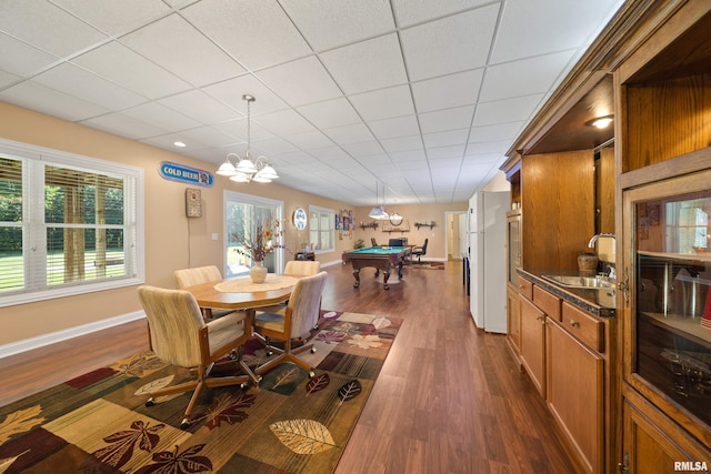 627 10th Ave, Silvis, IL 61282 - dining room with dark wood-style floors, billiards, and a chandelier